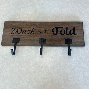 Wash and fold laundry sign with 3 hooks.